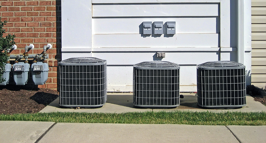 Three Air Conditioning Units and Power Meters At A Naples, FL area home