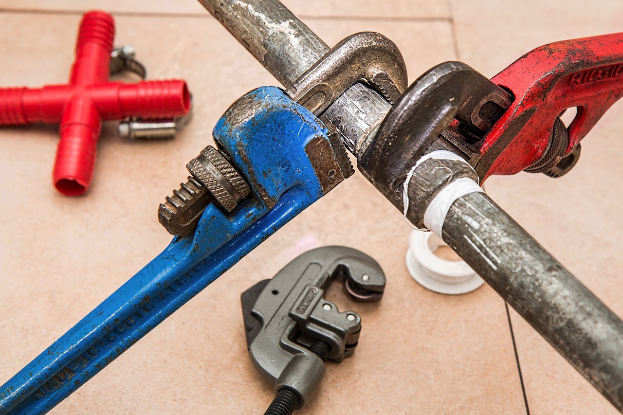 Pipe Wrench On Leaking Plumbing Pipes